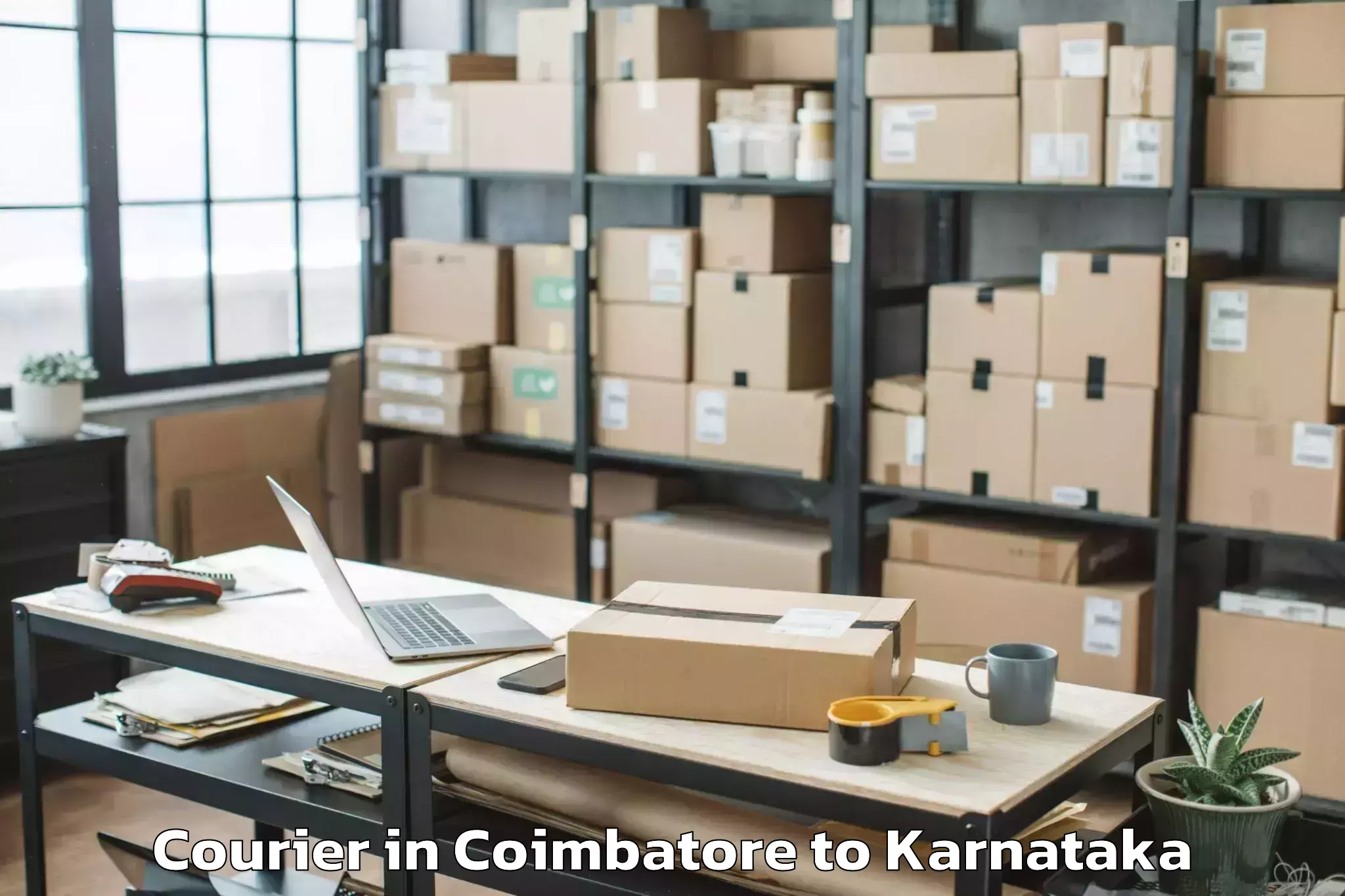 Coimbatore to Karnataka State Law University Courier Booking